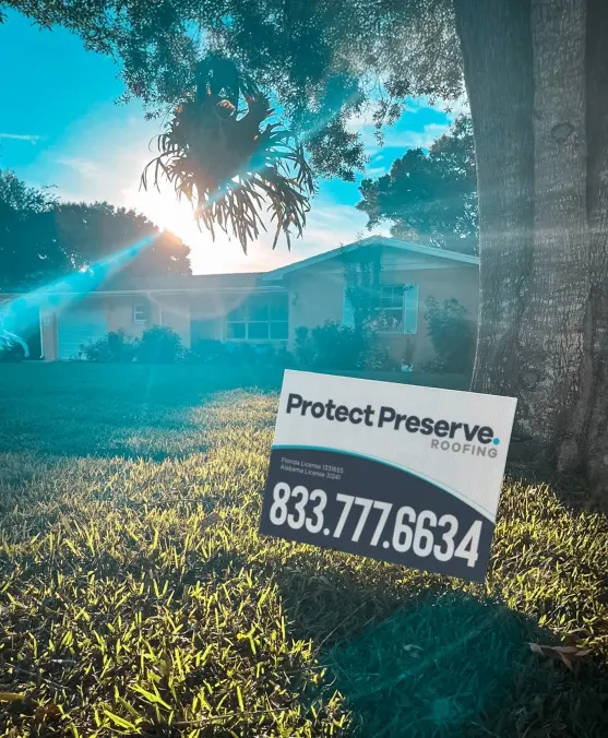 A Protect Preserve Roofing yard sign displayed on a lawn, representing a trusted Roofing Company in St Petersburg.