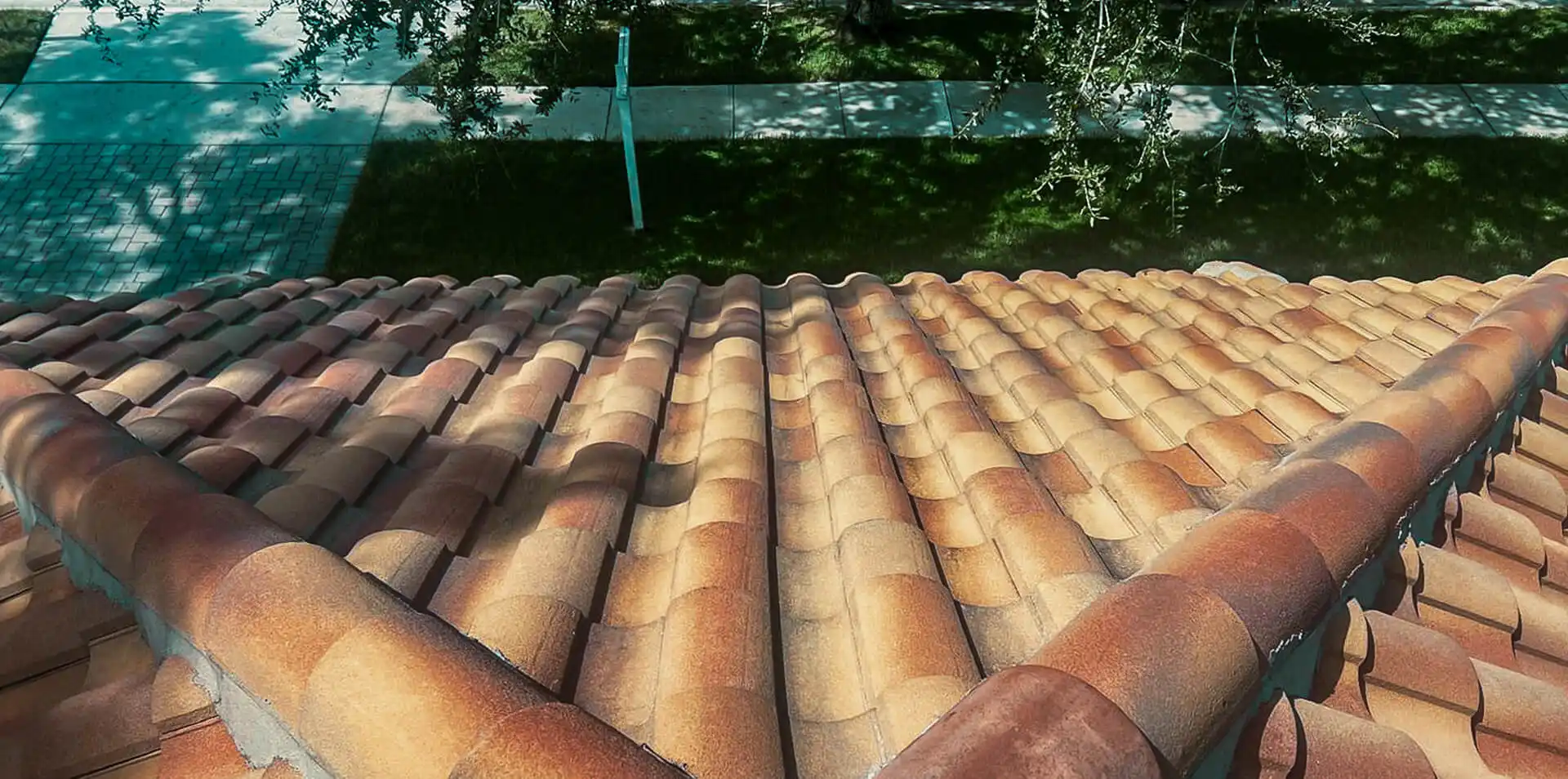 Close-up view of a well-maintained clay tile roof, showcasing durable materials for protect preserve roofing.