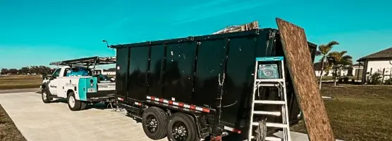 Service truck and dumpster on site for a Professional Roof Replacement Done Right