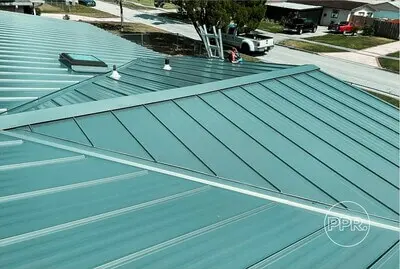 Modern metal roof installation on a residential home, offering long-lasting durability to protect and preserve roofing from weather elements.
