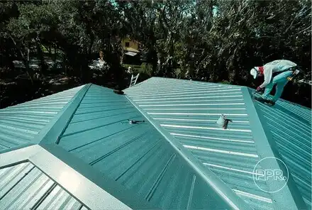 A roofing professional from Protect Preserve Roofing working on the repair of a standing seam metal roof, addressing damage or a leak.