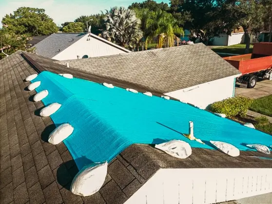 Emergency roof tarp installed after storm damage by a Roofing Company in St Petersburg to protect a residential home from water intrusion.