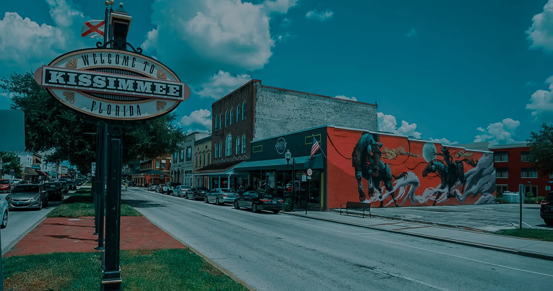 Aerial view of Kissimmee, FL, showing residential and commercial areas around the lake – service area of our Roofing Company Kissimmee.