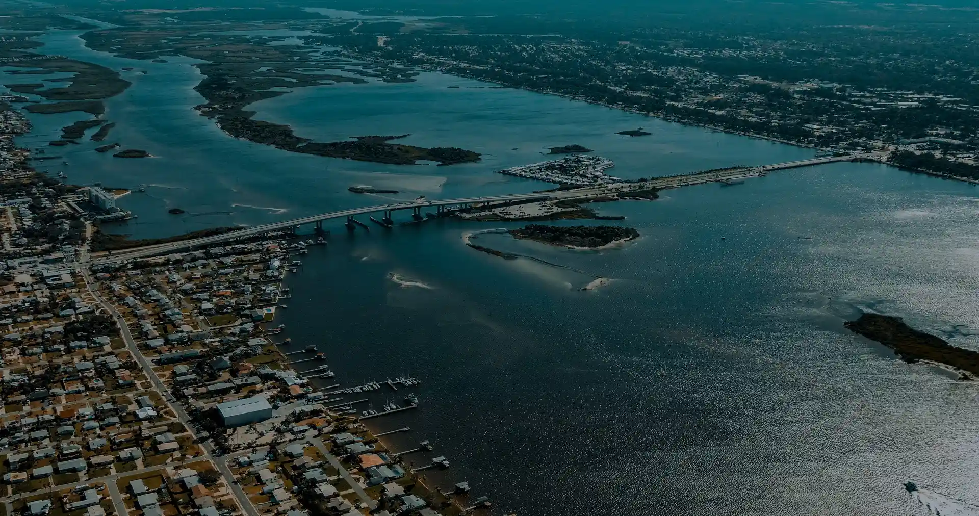 Aerial view of houses and water serviced by a roofing company in Port Orange.