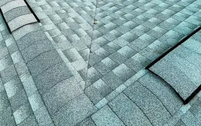 Close up of asphalt shingle roofing during professional new roof installation by a roofing company in Sanford.