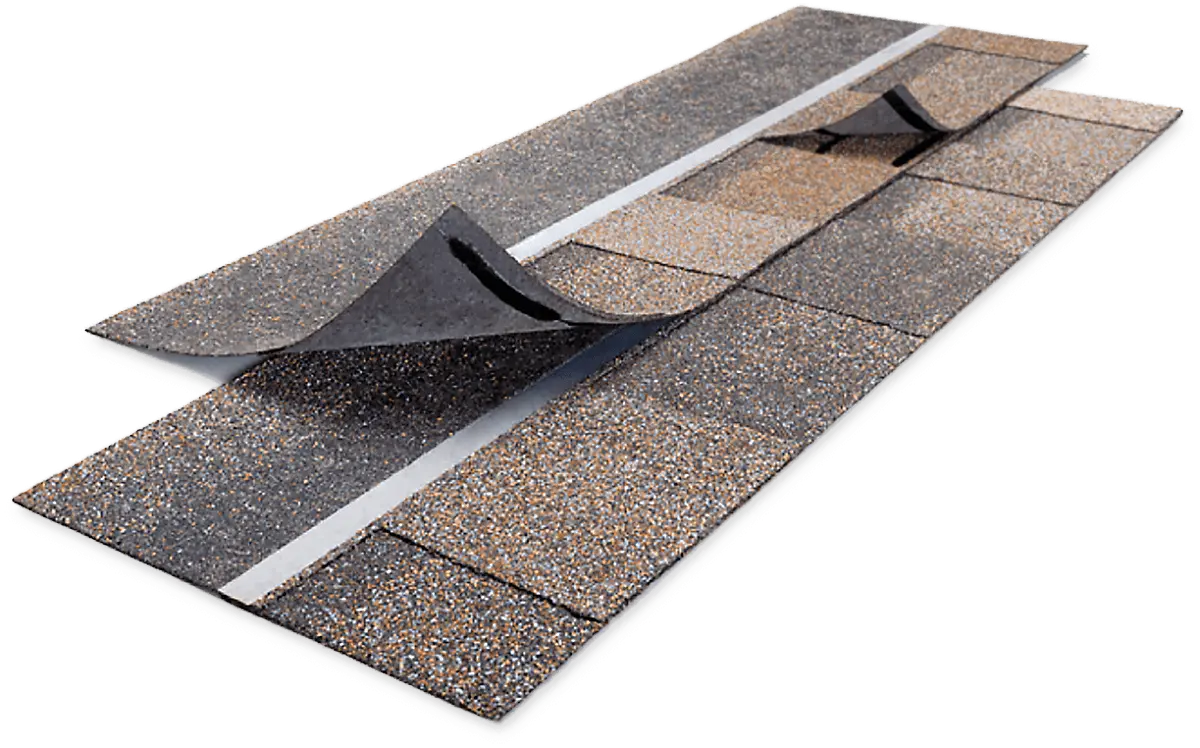 A sample display of Owens Corning SureNail Technology on laminated asphalt roofing shingles. The image shows several strips of dark, multi-toned shingles (gray and brown/tan) layered on top of each other. A shingle in the foreground and one in the background are partially peeled back to reveal a wide, bright white, woven fabric strip—the SureNail strip—running horizontally across the shingle to indicate a reinforced nailing zone. The shingles are shown on a white background