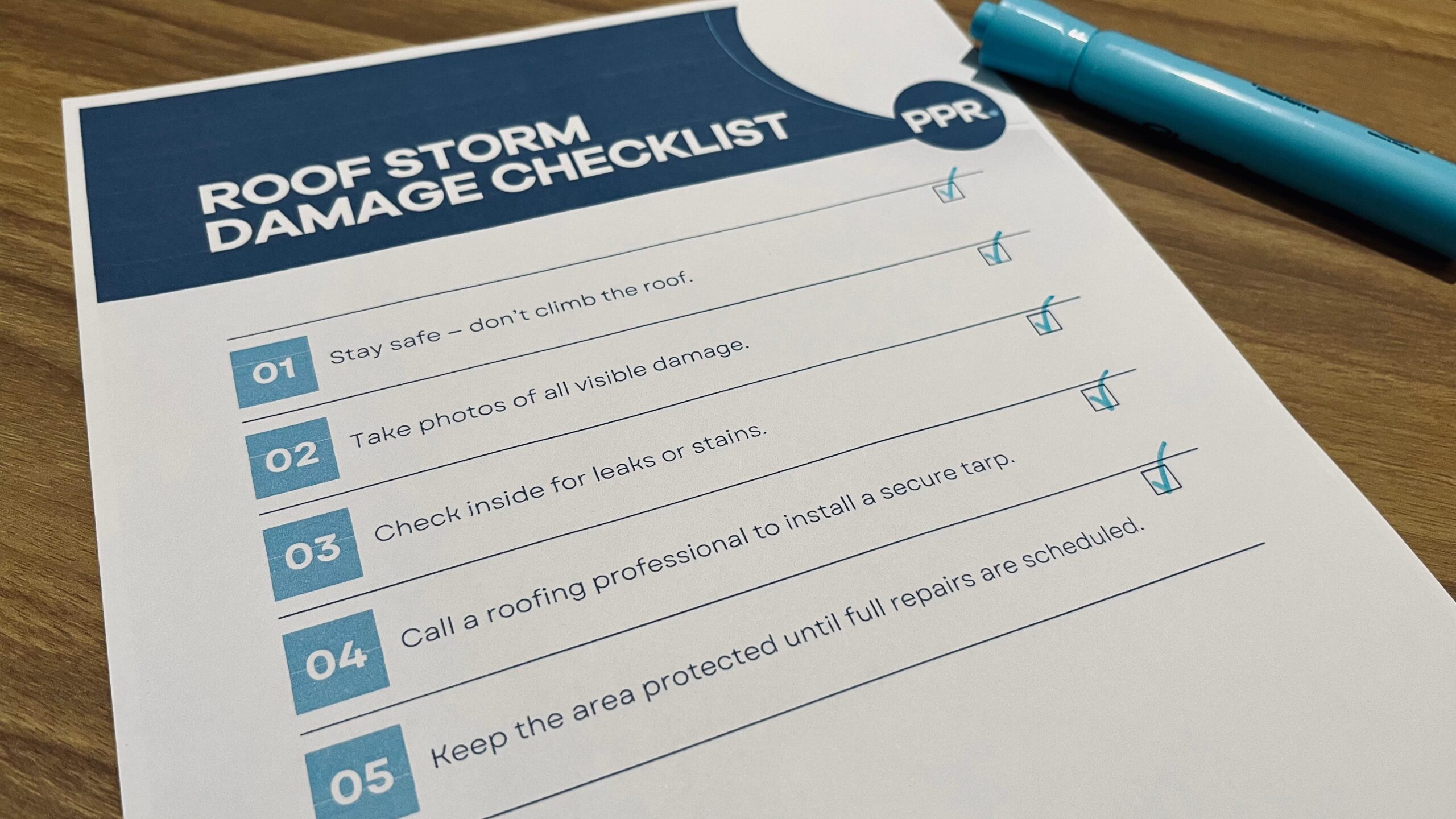 Paper with a checklist showing the steps to take after storm damage on a shingle roof.