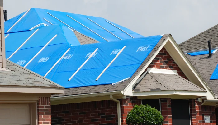 Roof covered with blue tarp to represent the keyword operation blue roof.