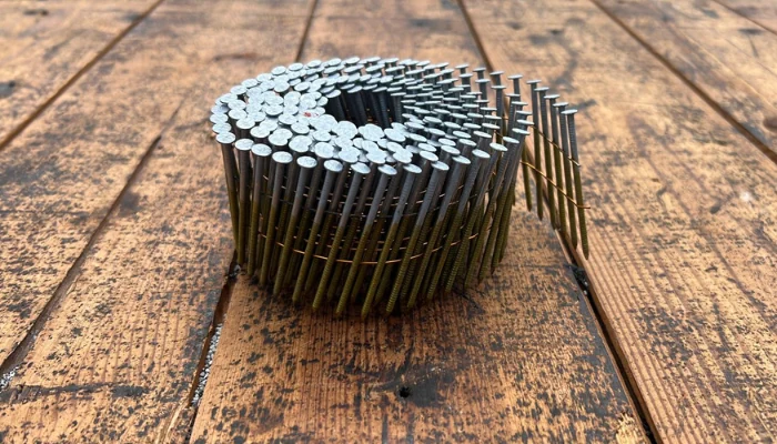 Several nails on a table to represent the keyword how to blue tarp a roof without nails.