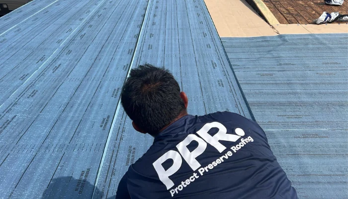 A man checking a roof to represent the keyword how to blue tarp a roof.