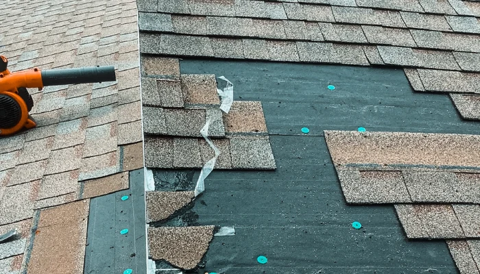 Roof with missing shingle to represent the keyword roof tih missing shingles.