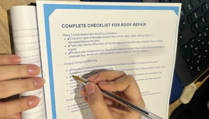 Paper with a checklist to represent the keyword checklist for roof repair.