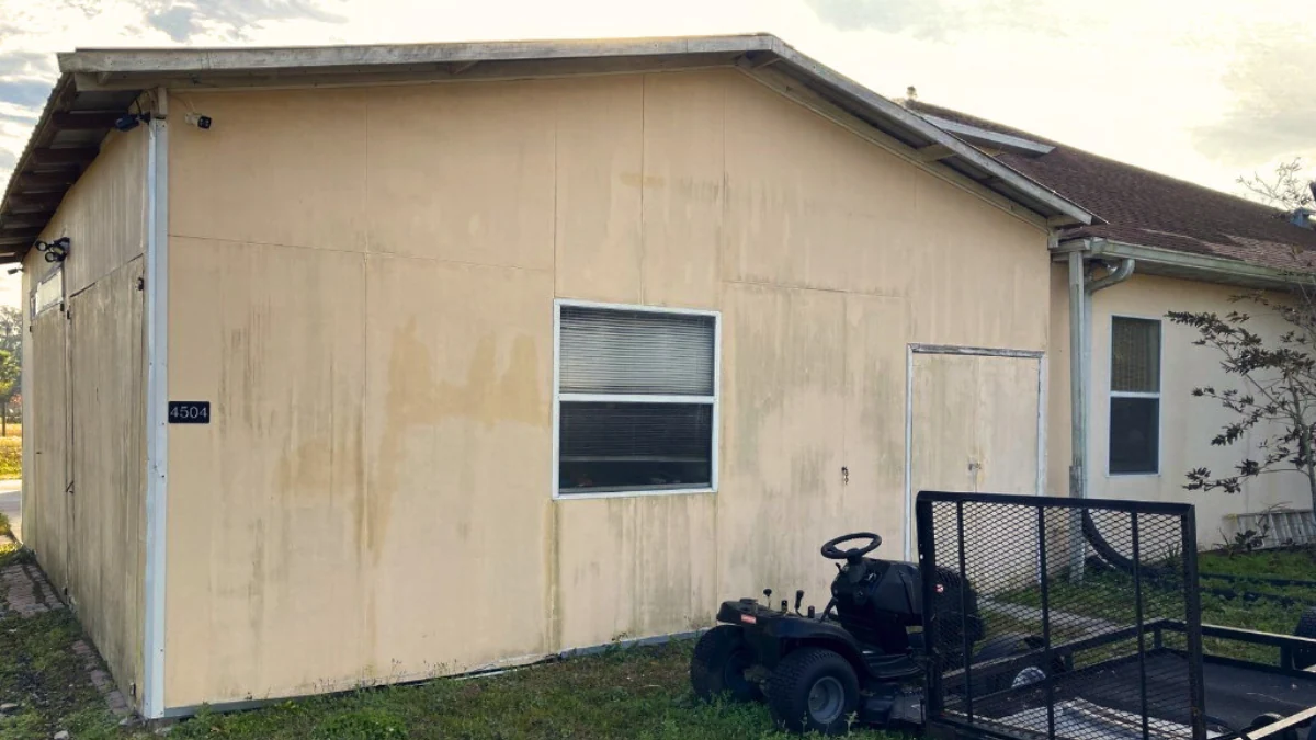 Exterior part of a house with rain damage to represent the keyword does homeowners insurance cover water damage from leaking roof.