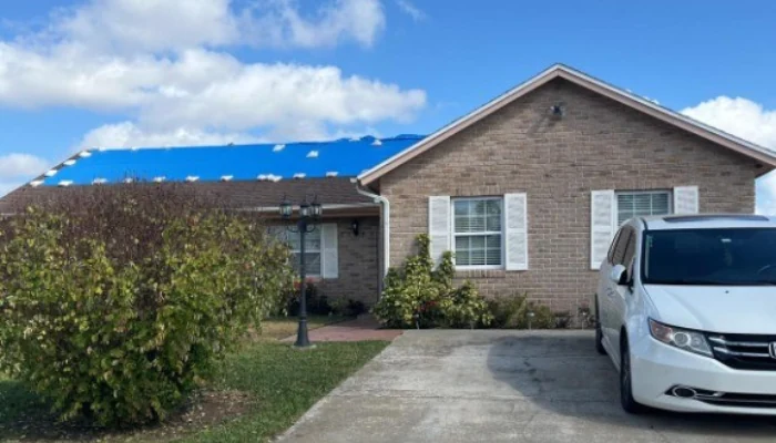Blue tapr installed to represent the keyword emergency tarp service.
