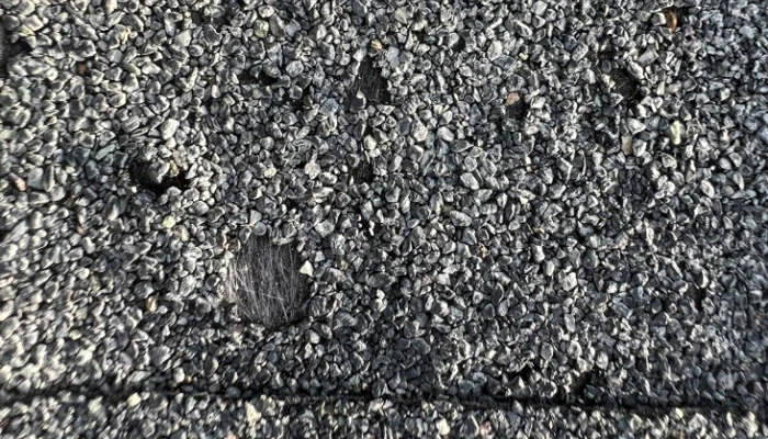 Roof with missing tiles to represent keyword roof emergency.