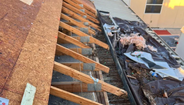 Roof being replaced to represent keyword water damaged roof.