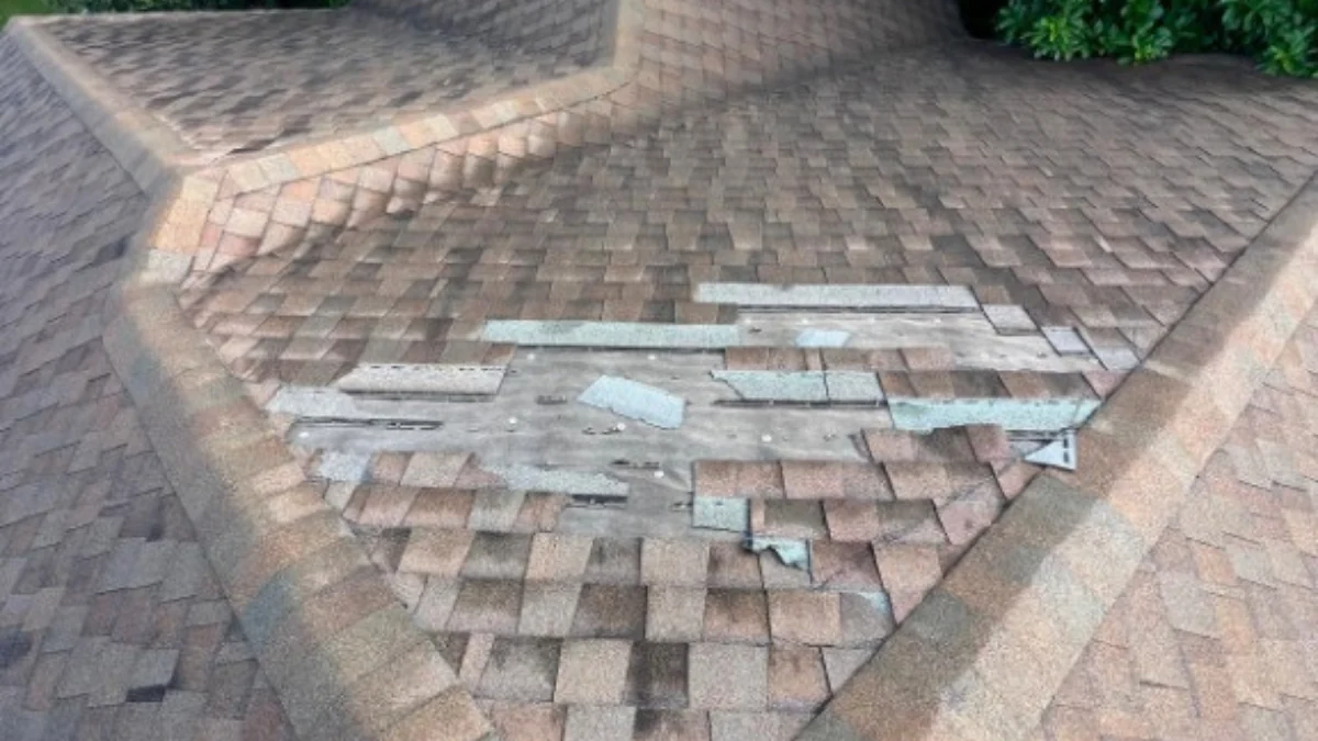 Roof with some tiles missing to represent the keyword what should I do if I need roof repair.