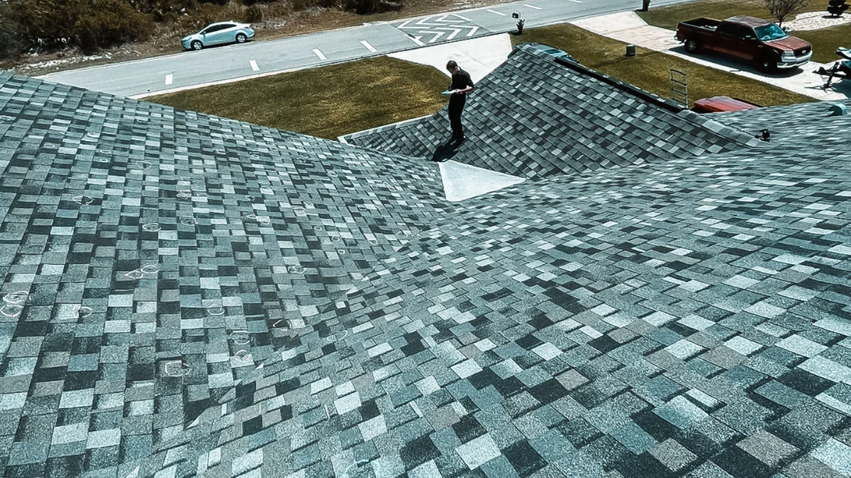 Shingle roof photographed from above to represent the keyword are roof leaks covered by insurance.