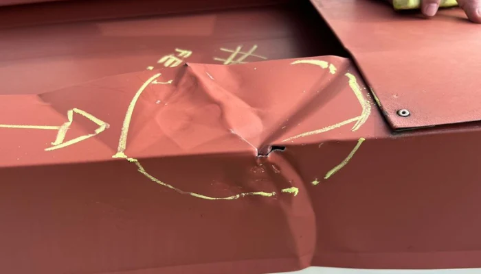 Metal roof showing defect to represent keyword metal roof.