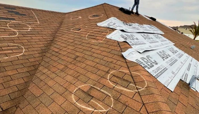 Roof with marking of defects to be repaired to represent the keyword roof damage is covered by home insurance.
