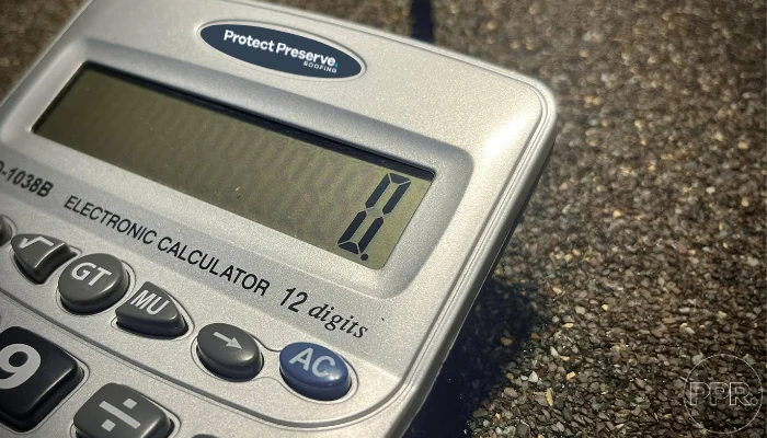 A gray calculator to represent the keyword shingle type and installation.