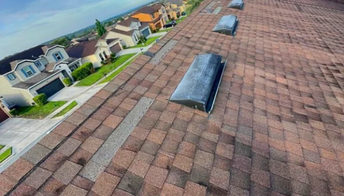 Roof photographed from above to show shingles being repaired to represent the keyword common problems with roof shingles.