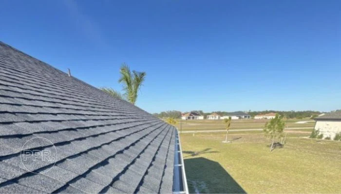 Shingle roof with clean gutter to represent the keyword right roofing material.