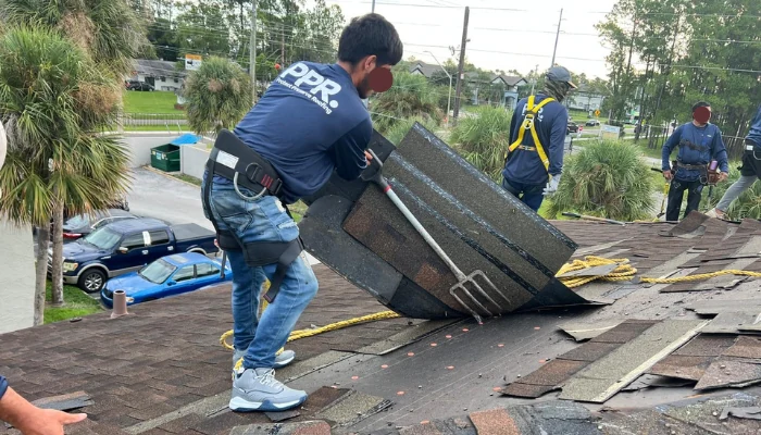 Team working on a roof replacement to represent the keyword roof replacement.