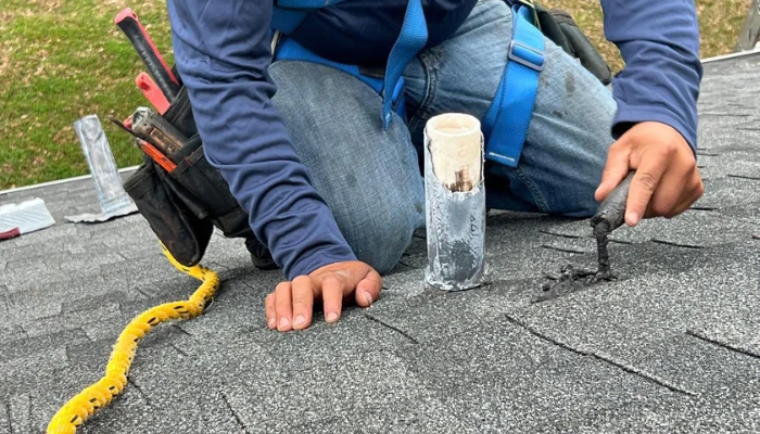 Repair being carried out on roof to represent the keyword asphalt shingle roof repair.