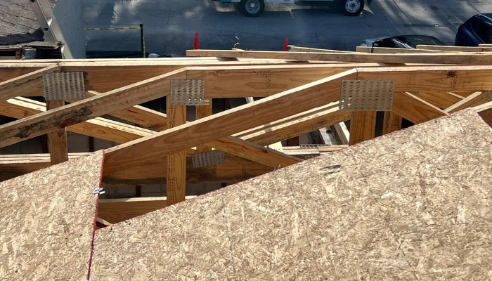 Wooden deck being installed on roof to represent keyword how roof deck protection is installed.