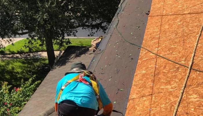 Man redoing roof deck to represent keyword synthetic roof deck.