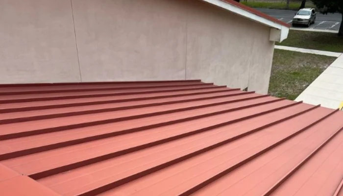 Red metal roof seen from above to represent keyword metal roof systems.