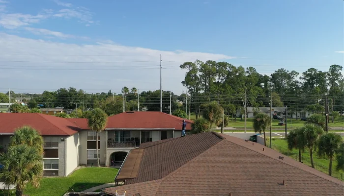 Multiple rooftops in a calm neighborhood to represent the keyword storm damage repair.