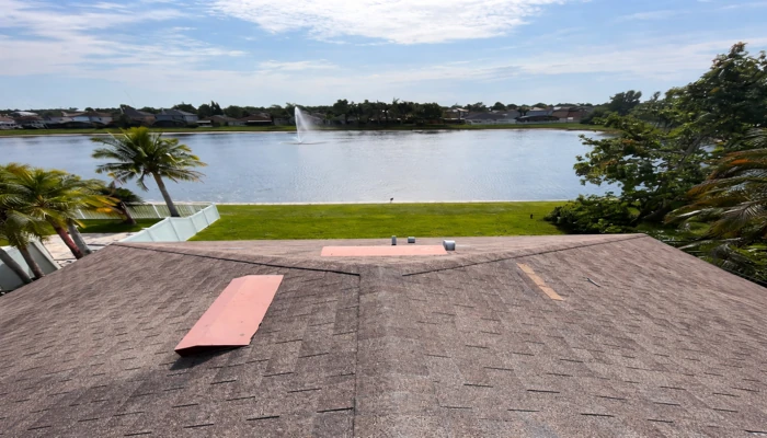 Concrete tile roof vs asphalt shingles example of an asphalt shingle roof on a Florida home, highlighting climate exposure and roof slope conditions.
