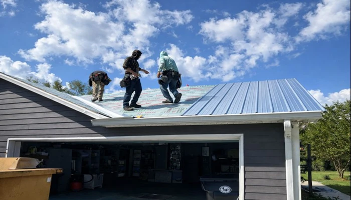 Roofing professionals installing a standing seam metal roof, illustrating labor factors that impact how much are metal roofs in florida.